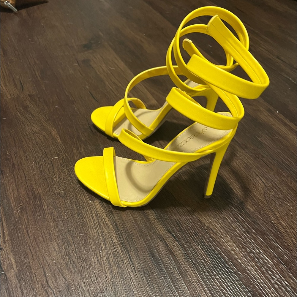 Yellow, ankle wrap heels.